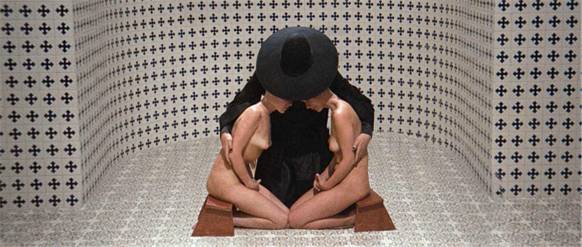 Título: cannes-69399 - Descrição: The Alchemist embracing two seated figures inside a tiled chamber