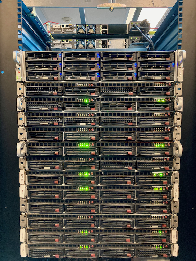 SDF in 2021: a rack of network switches and servers that run the shell hosts