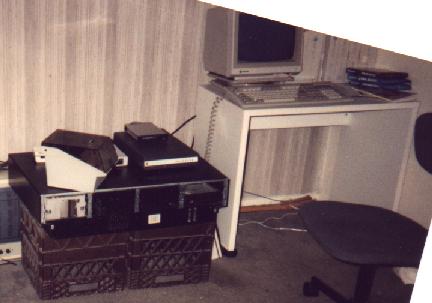 SDF in 1993: the server sitting on two brown milk crates in an apartment, with dialup modems stacked on top