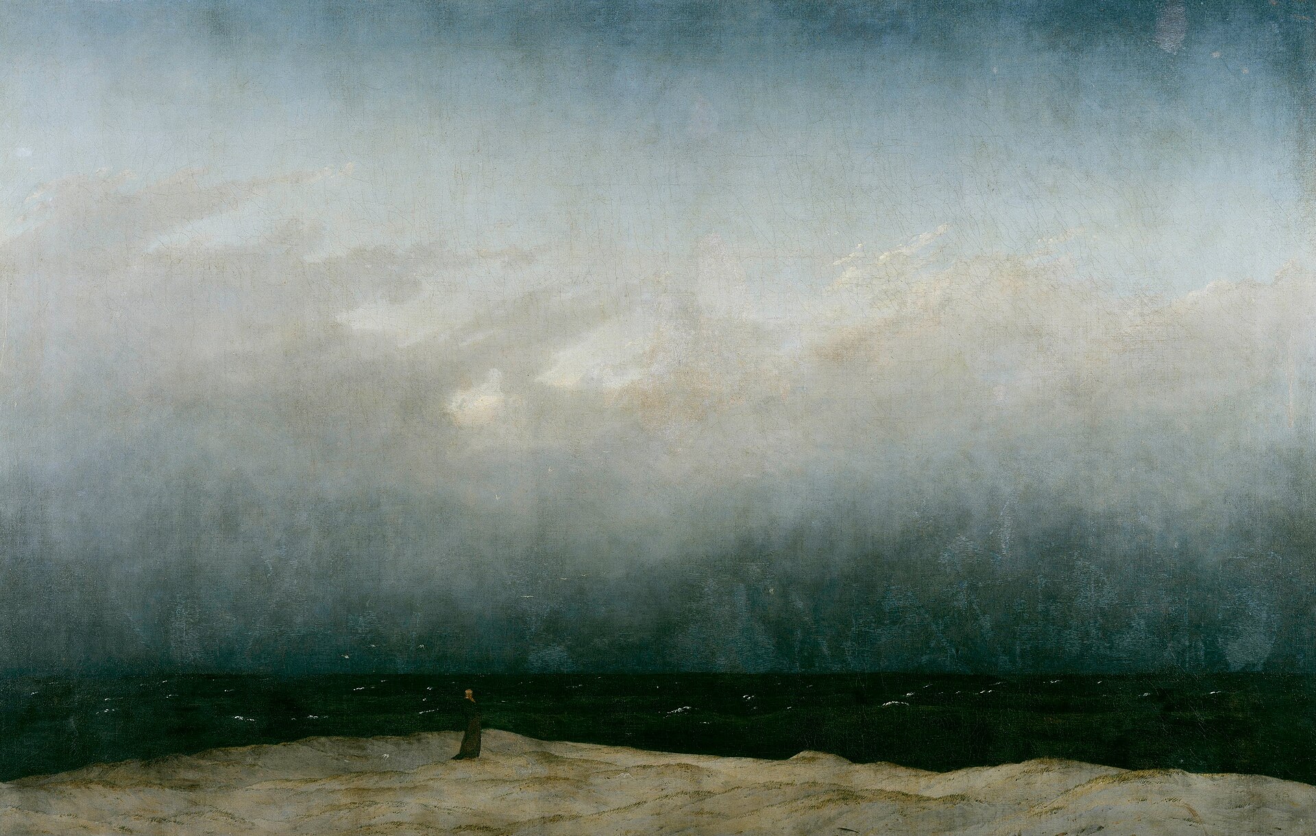 Caspar David Friedrich's The Monk by the Sea (1808 to 1810): a tiny solitary figure on a pale shore before a vast dark sea and an enormous sky